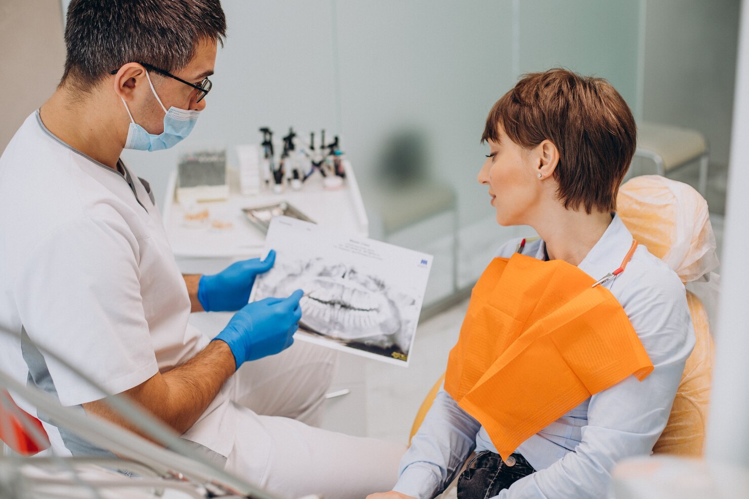 Dentist Consulting with Patient