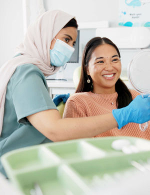 Female Dentist Holding a Mirror