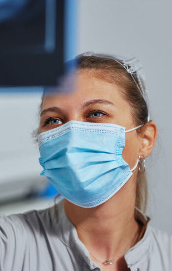 Female Dentist Looking at Treatment Plan